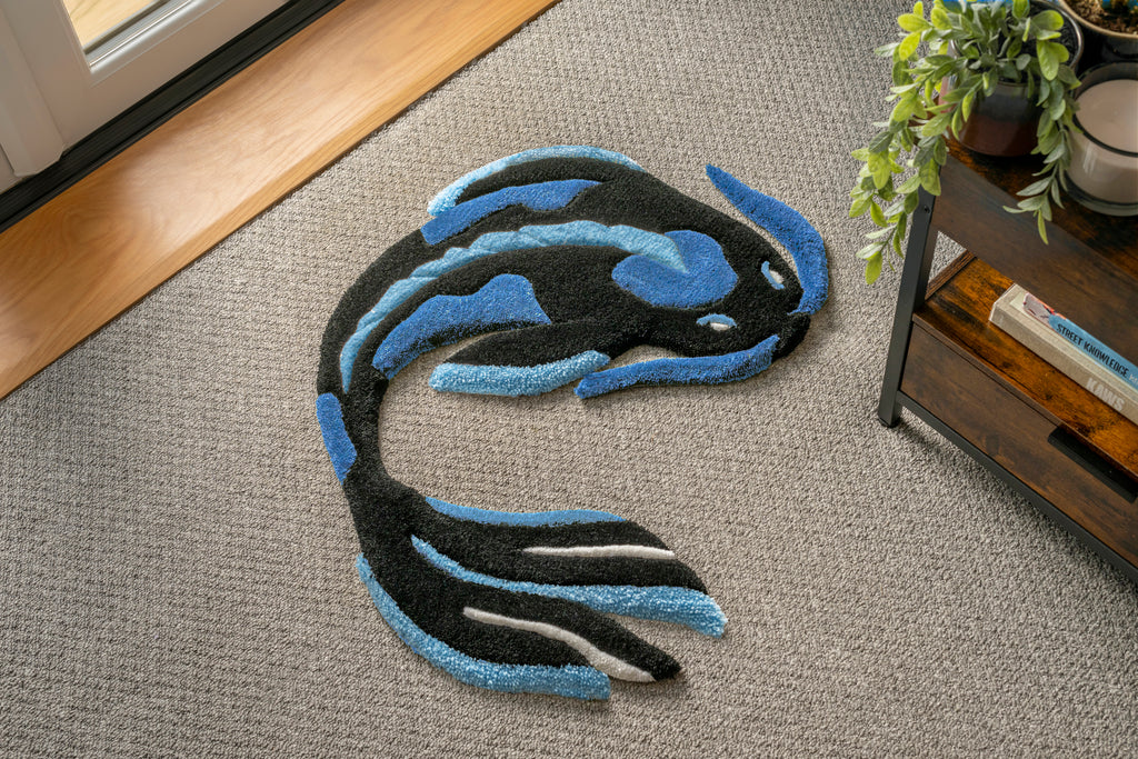 Handmade blue koi fish rug featuring flowing black, blue and white details inspired by traditional Japanese koi fish artwork.