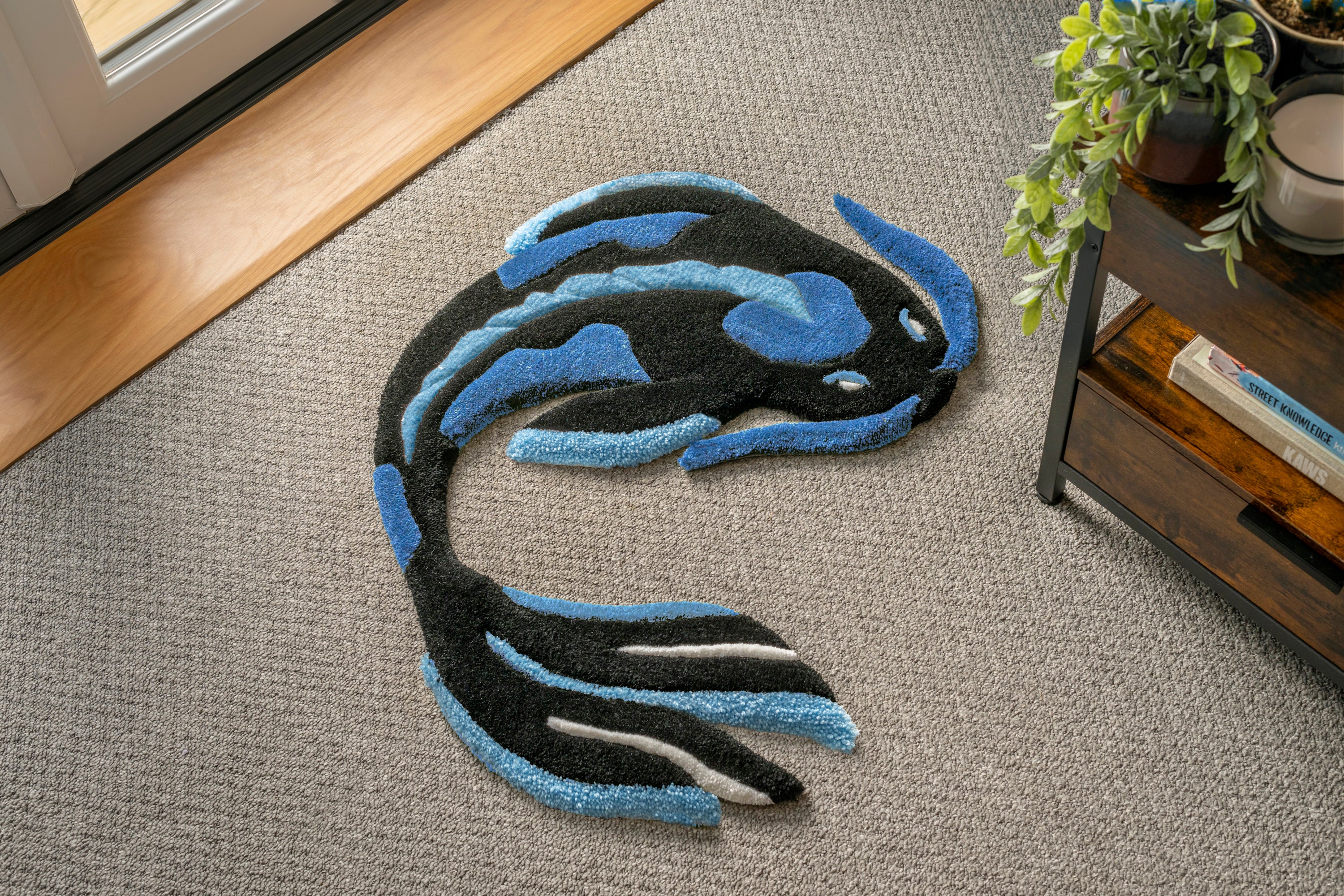 Handmade blue koi fish rug featuring flowing black, blue and white details inspired by traditional Japanese koi fish artwork.