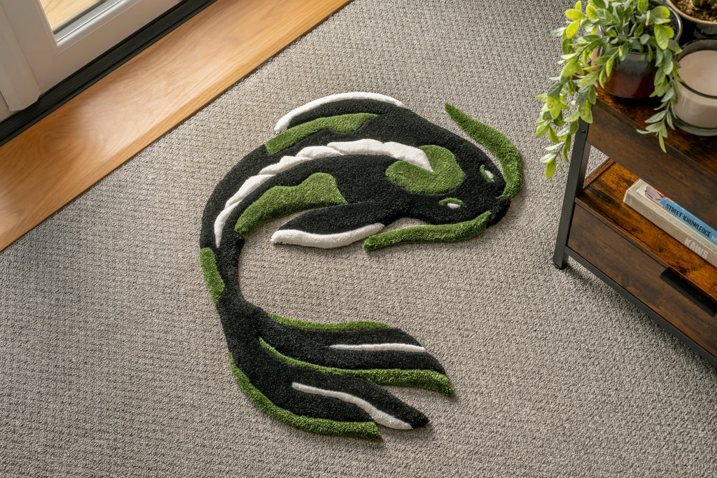 Handmade dark green koi fish rug featuring flowing black, green and white details inspired by Japanese koi fish artwork.
