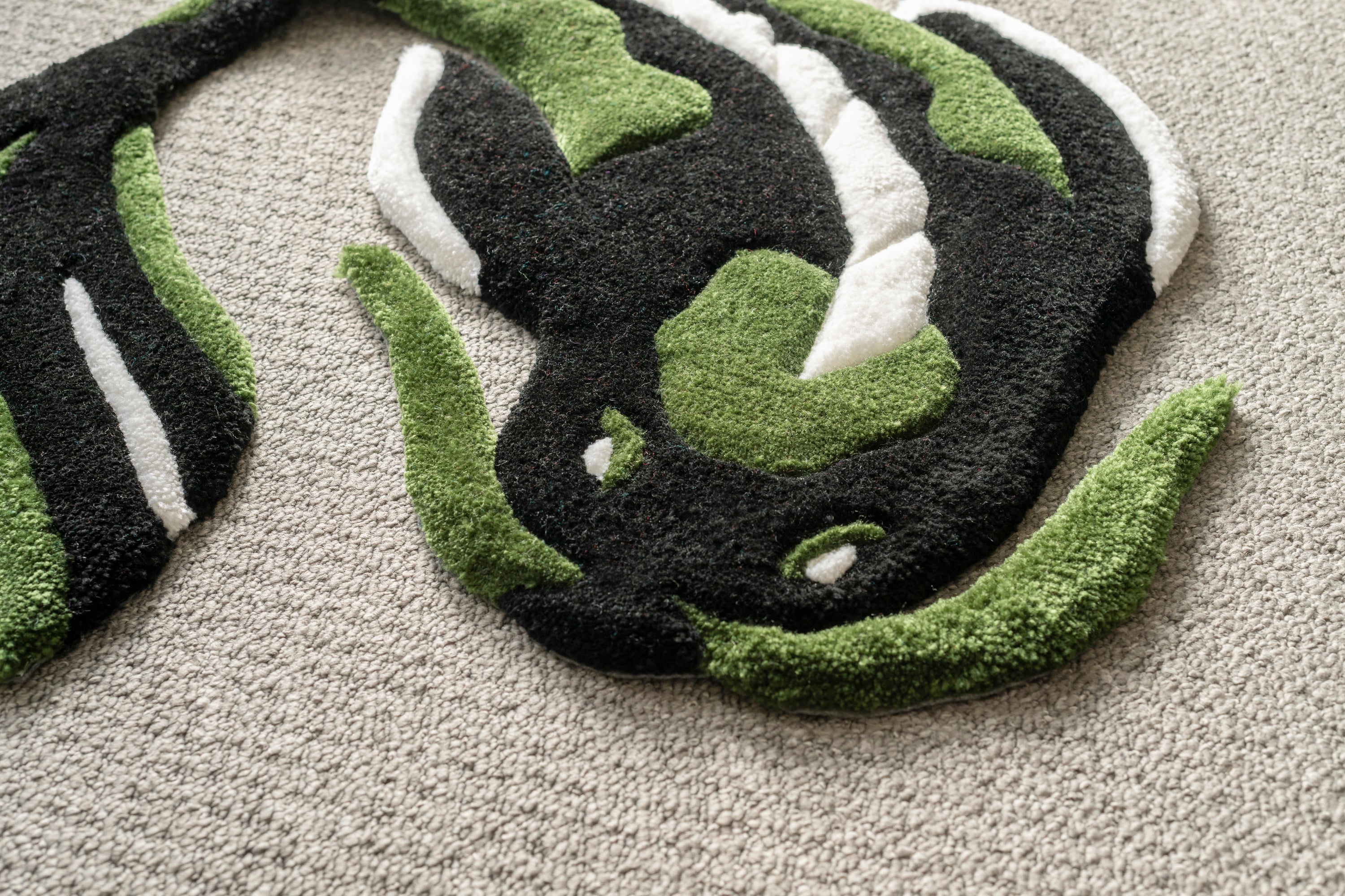 Detailed texture shot of a handmade koi fish rug highlighting soft acrylic yarn and premium low-pile craftsmanship.