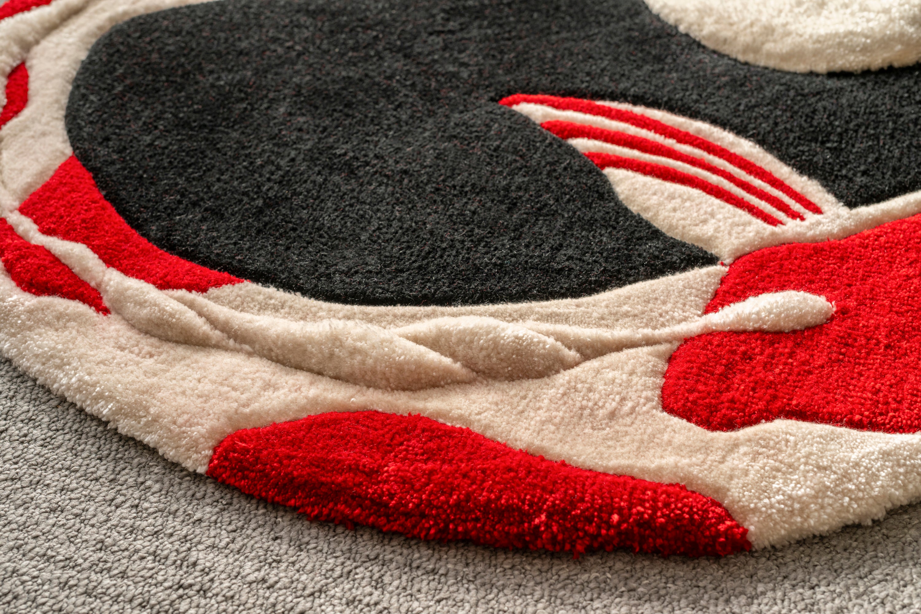 Textured tufting detail of the Moonlit Koi Rug showing the craftsmanship and layered design elements.