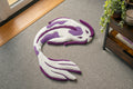 Handmade white and purple koi fish rug with flowing Japanese-inspired design and soft low-pile tufted texture.