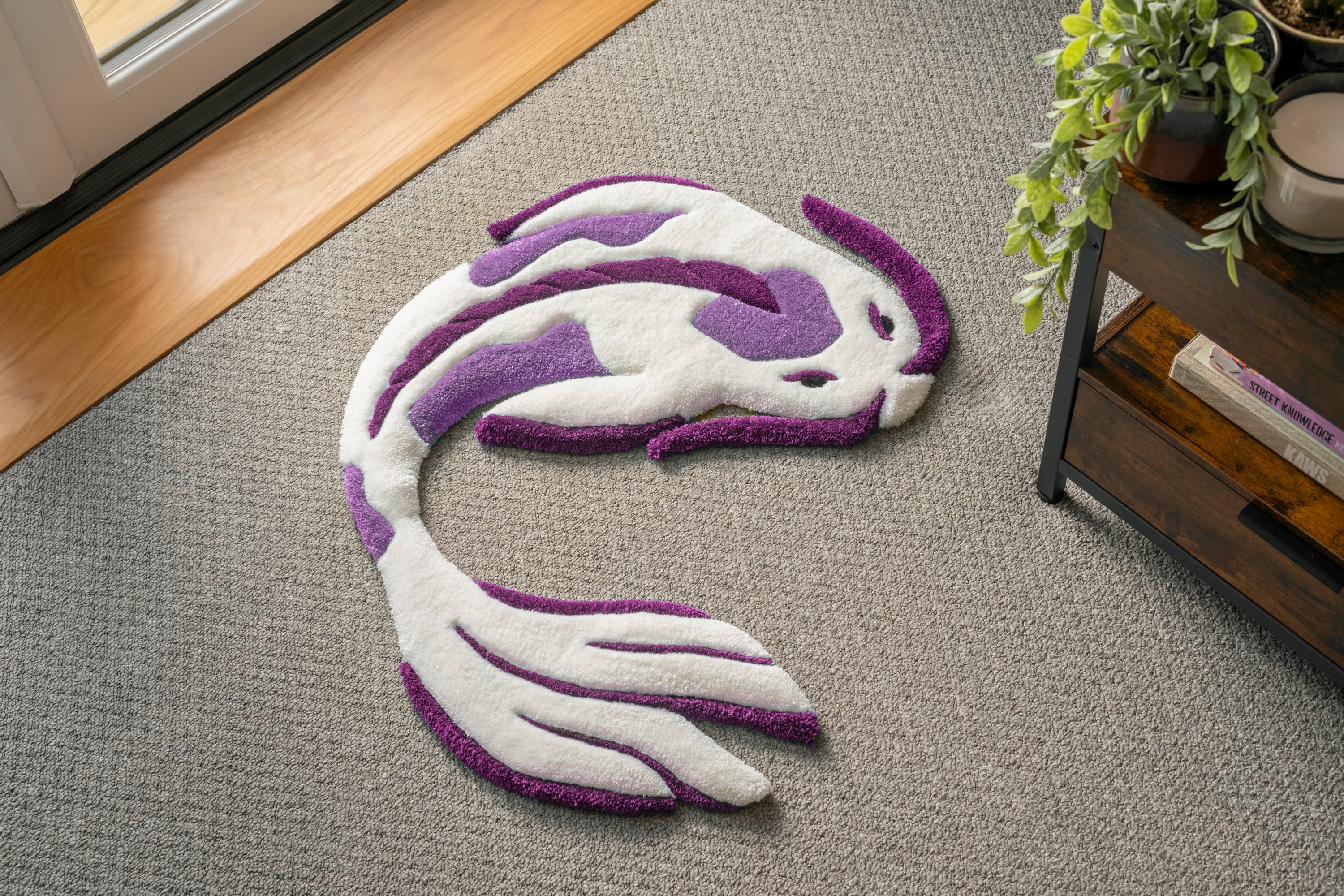 Handmade white and purple koi fish rug with flowing Japanese-inspired design and soft low-pile tufted texture.