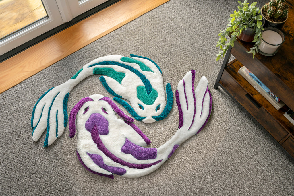 White teal and white purple koi fish rugs arranged in a yin yang formation, inspired by traditional Japanese koi symbolism.